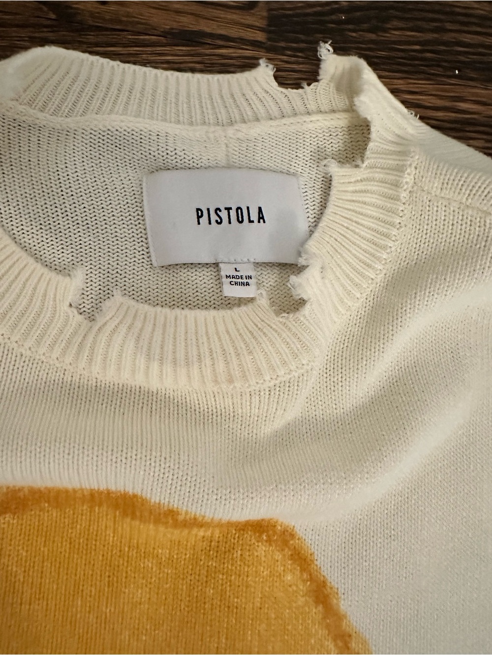 Pistola cream sweater with yellow smiley face